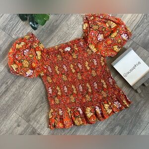 Maisie Zina puff shoulder peplum smocked blouse. Size L